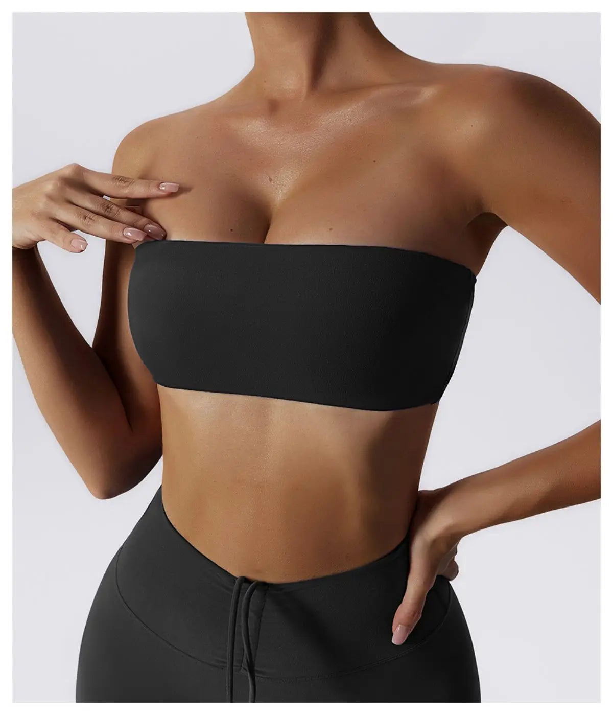 Black bandeau bra front view with hand on hip