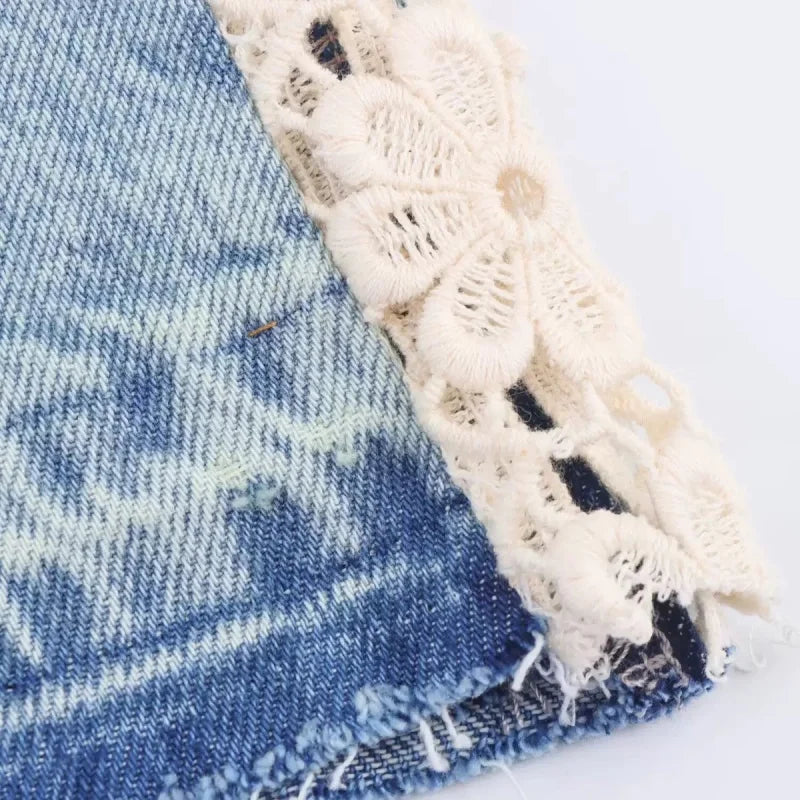 Crochet lace trim and frayed hem detail on light wash denim