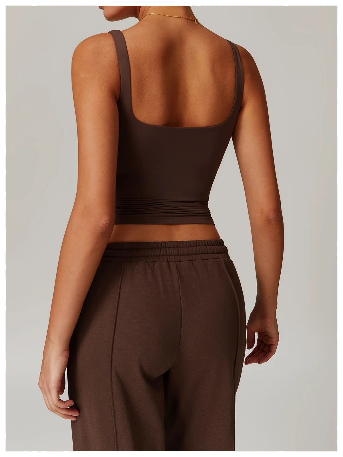 Coffee tank top back view worn with matching trousers