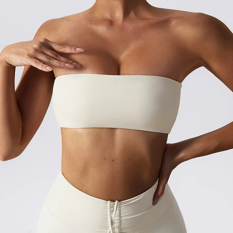 Ivory strapless bandeau bra worn with matching leggings