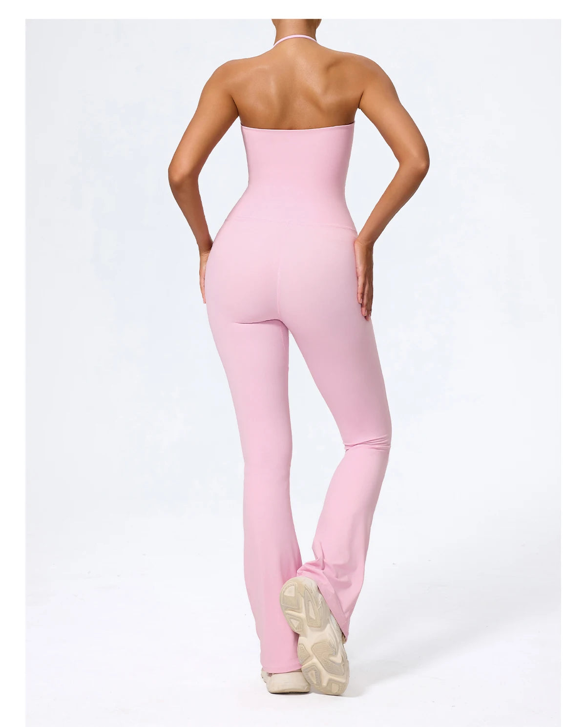 Pink jumpsuit back view showing the open halter back to the waist