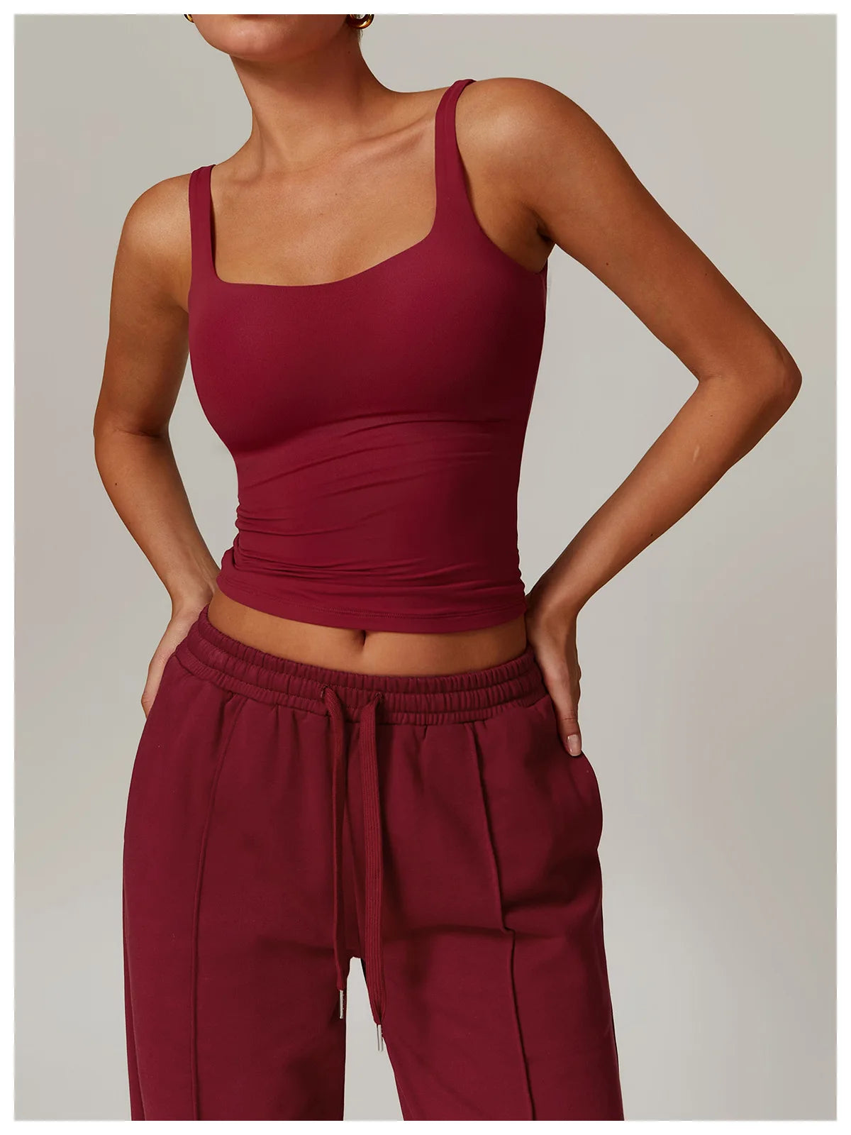 Red tank top and trouser outfit, front view on model