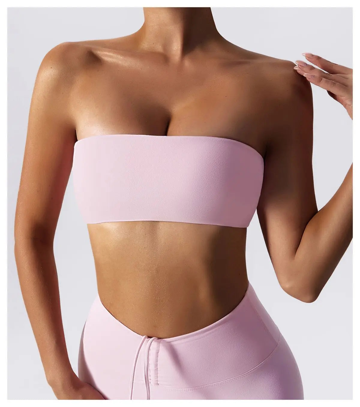 Pink wireless strapless bra front view with high waisted leggings