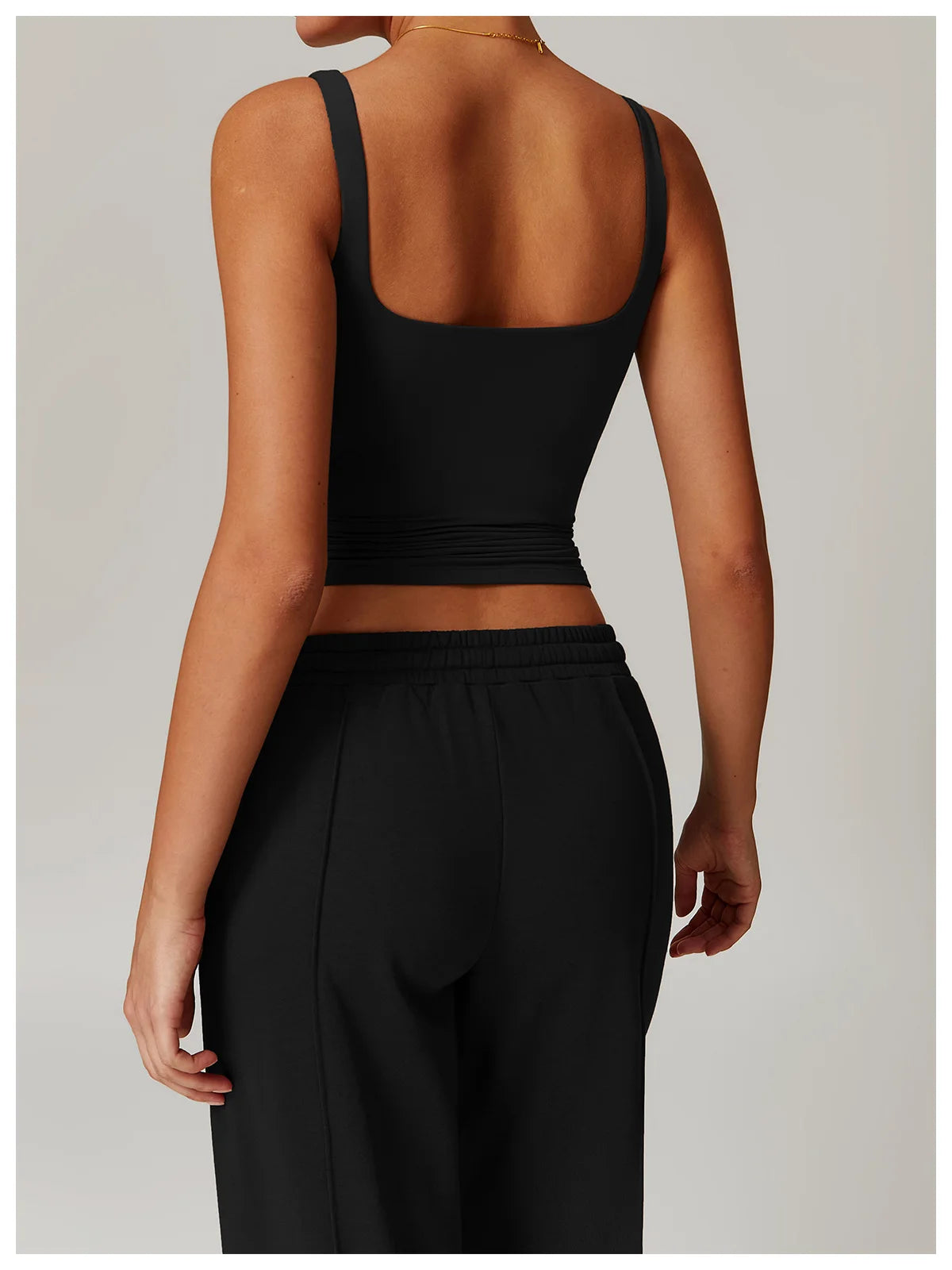 Black tank top with built in bra, front view on model