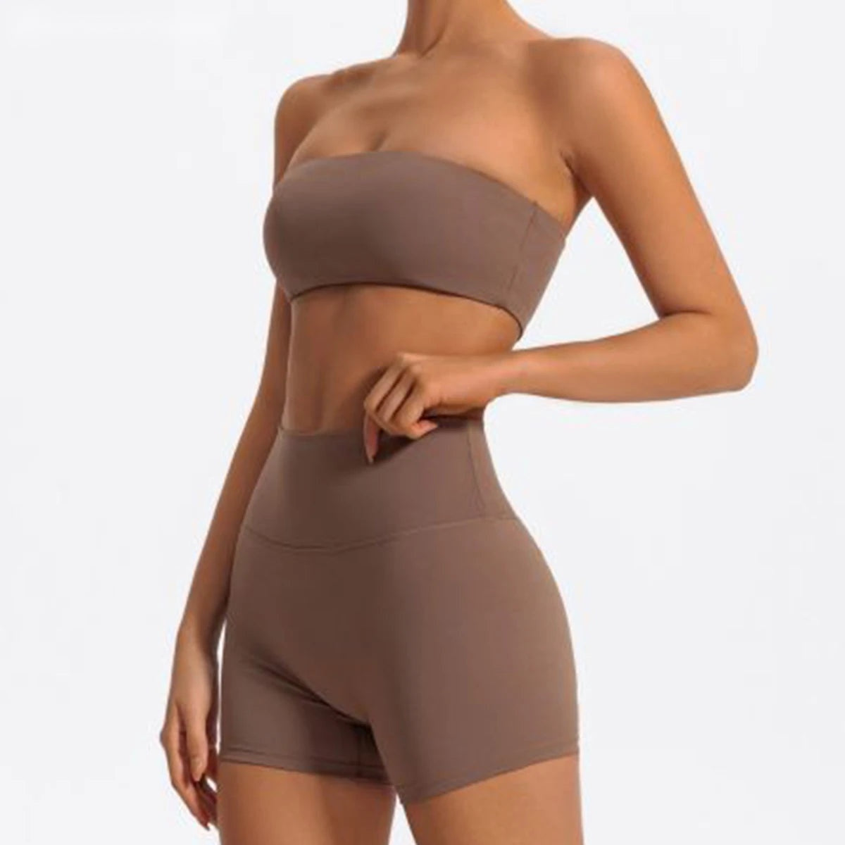 Matching workout set in brown with bandeau bra and high waist shorts, front view