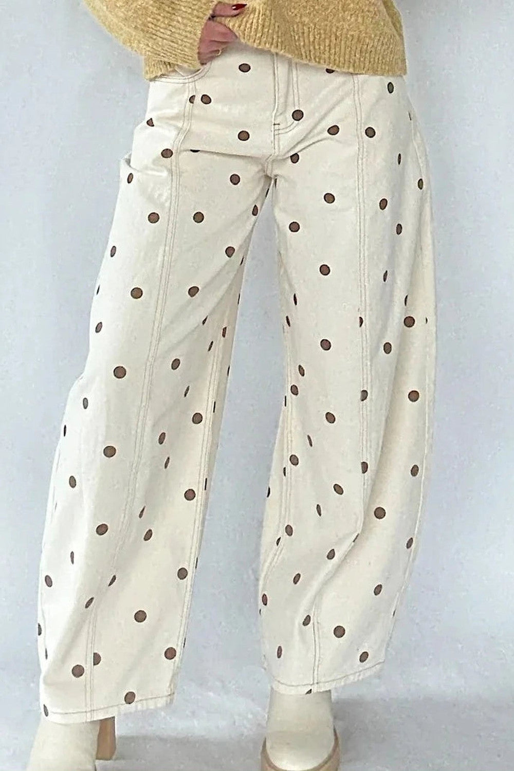 Cream barrel jeans with brown polka dots styled with a knitted jumper