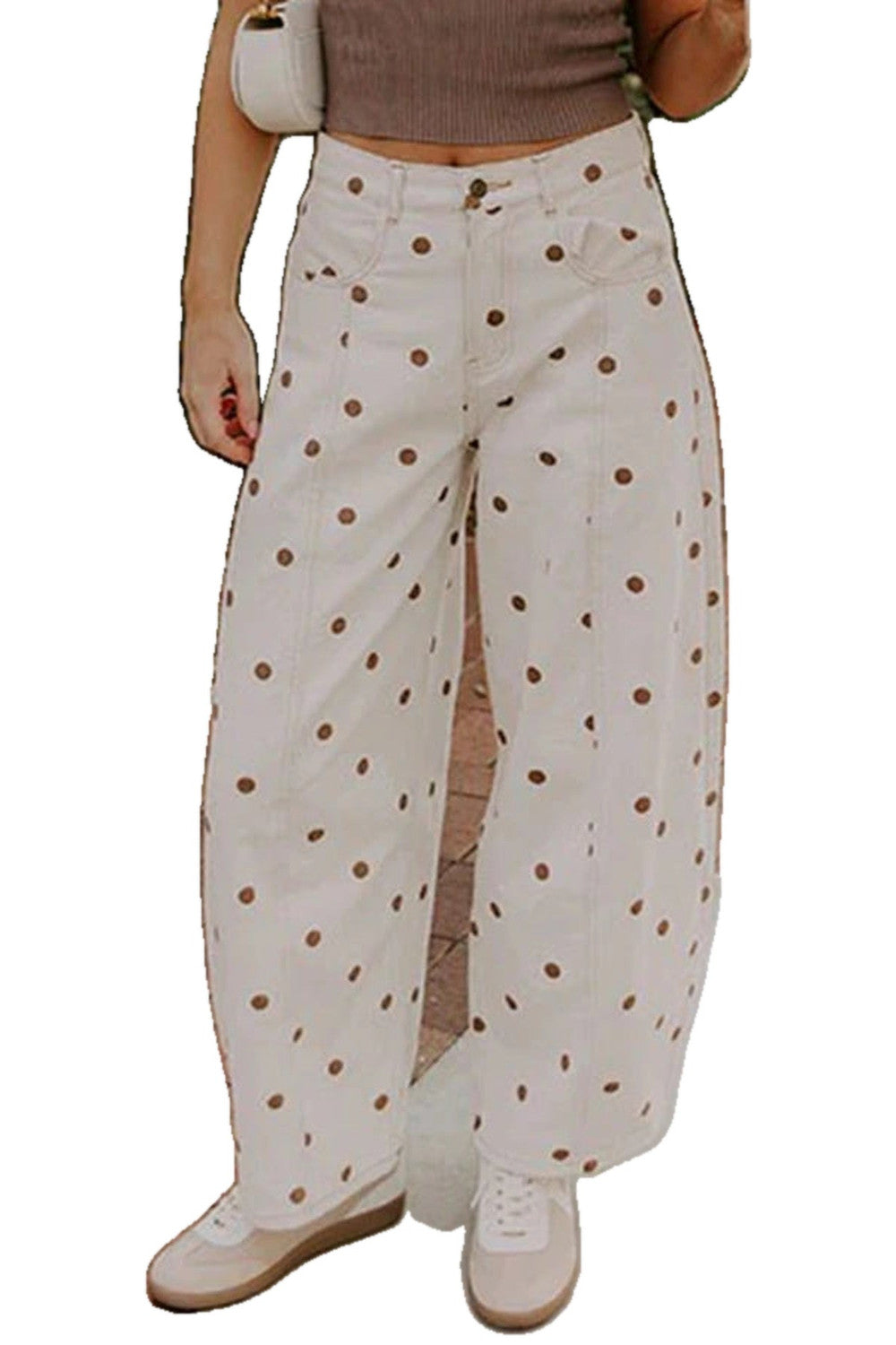 Cream barrel jeans with brown polka dots styled with a fitted top