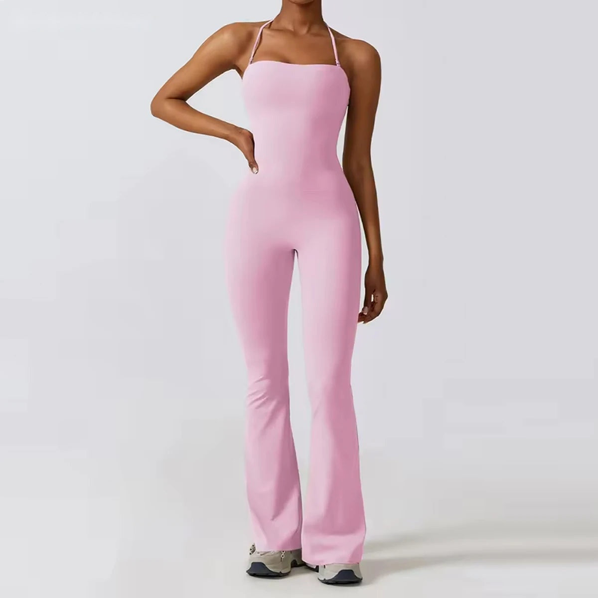 Casual jumpsuit for women in pink, front view with halter neck and wide flared leg