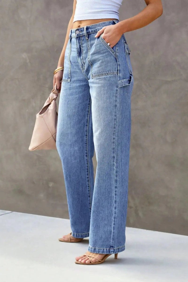 Wide leg cargo jeans, three quarter front, hand in patch pocket