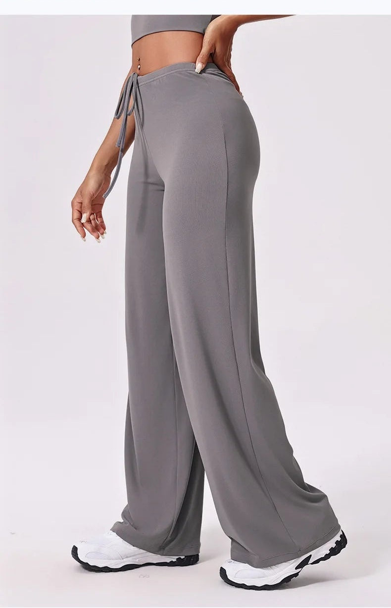 Grey flare yoga pants side view mid-stride