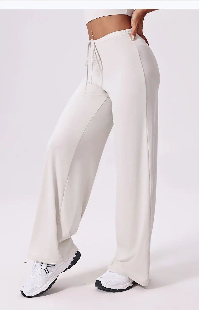 White yoga pants with pockets, back view