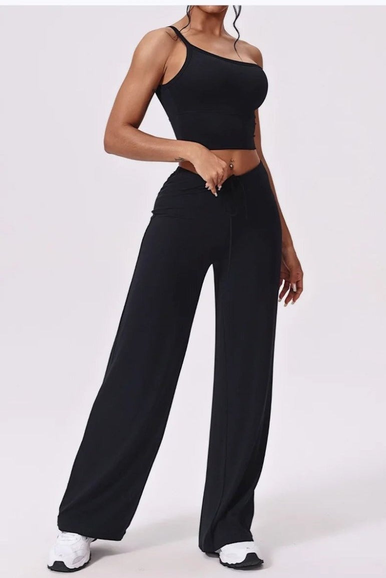 Black high waisted wide leg yoga pants, front, hand at waist