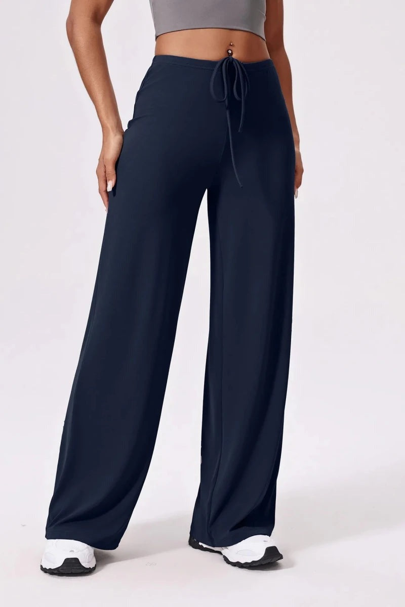 Navy blue wide leg yoga pants with drawstring waist, front