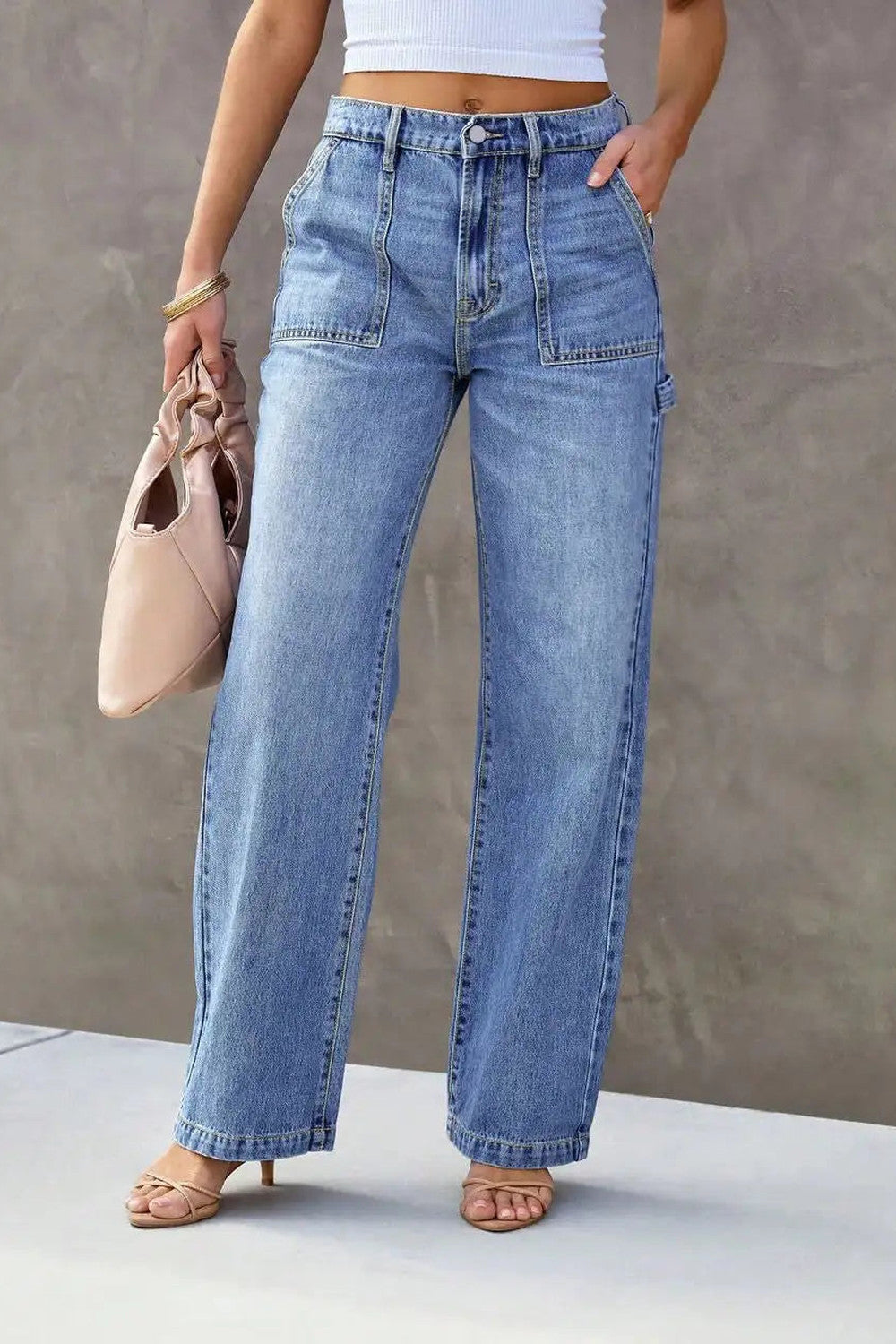 Light blue wide leg jeans with a high waist and utility pockets, shown full length from the front