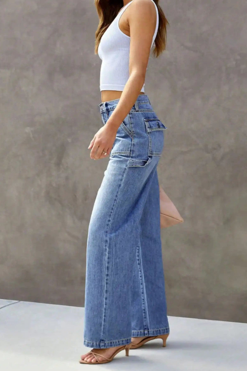 Side profile of light blue wide leg jeans showing the straight leg line
