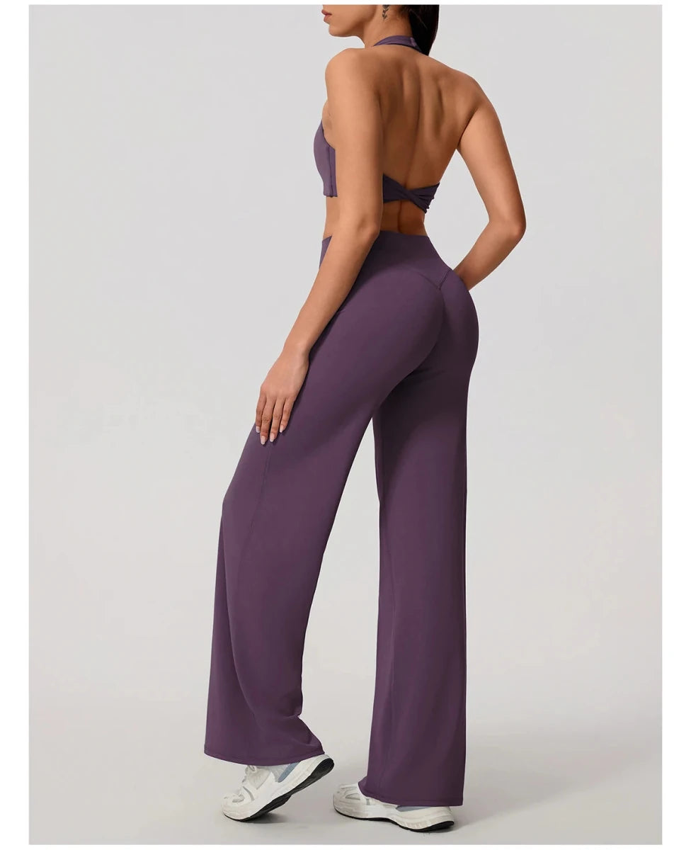 Smoke purple pilates outfit with open back halter bra and wide leg trousers, side