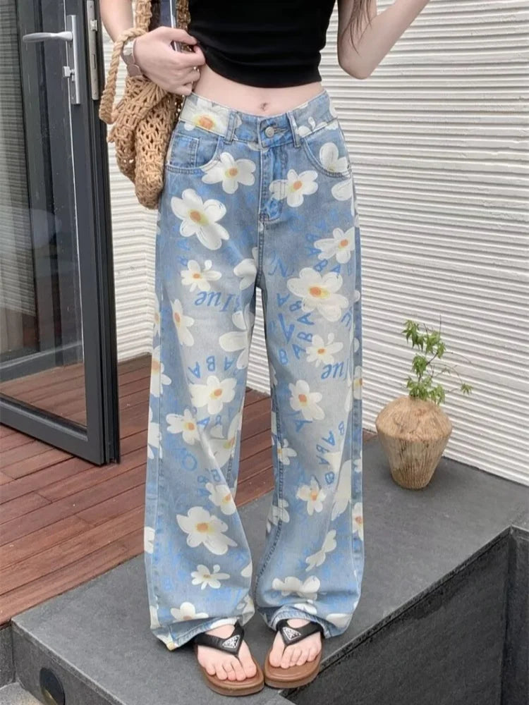 Floral jeans for women in a light wash, white daisy print, front full length