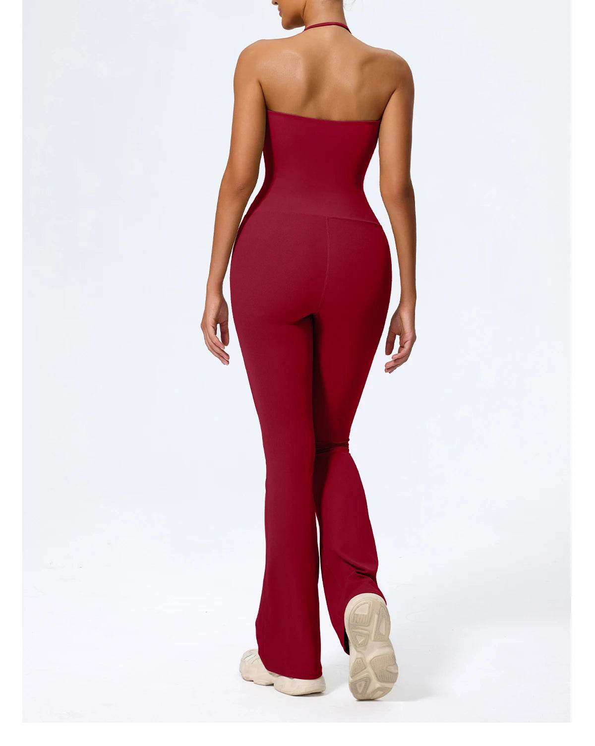 Red jumpsuit back view showing the open halter back