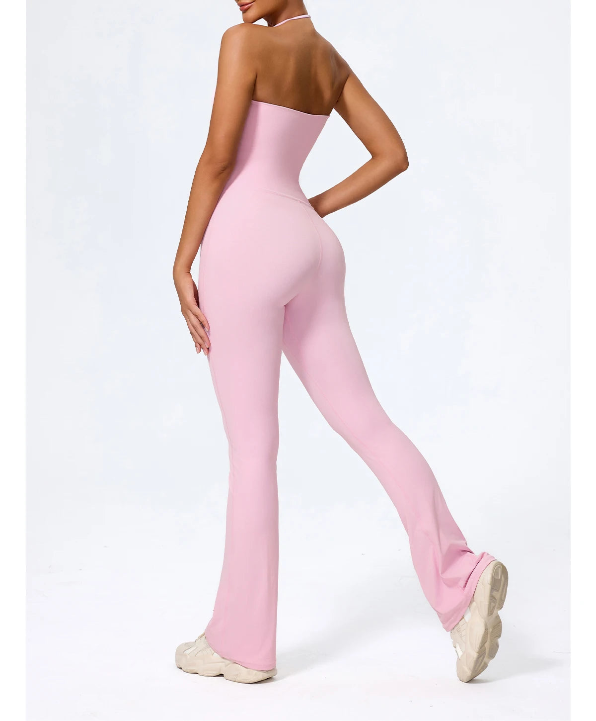 Pink one piece jumpsuit in motion, showing how the wide leg moves when walking