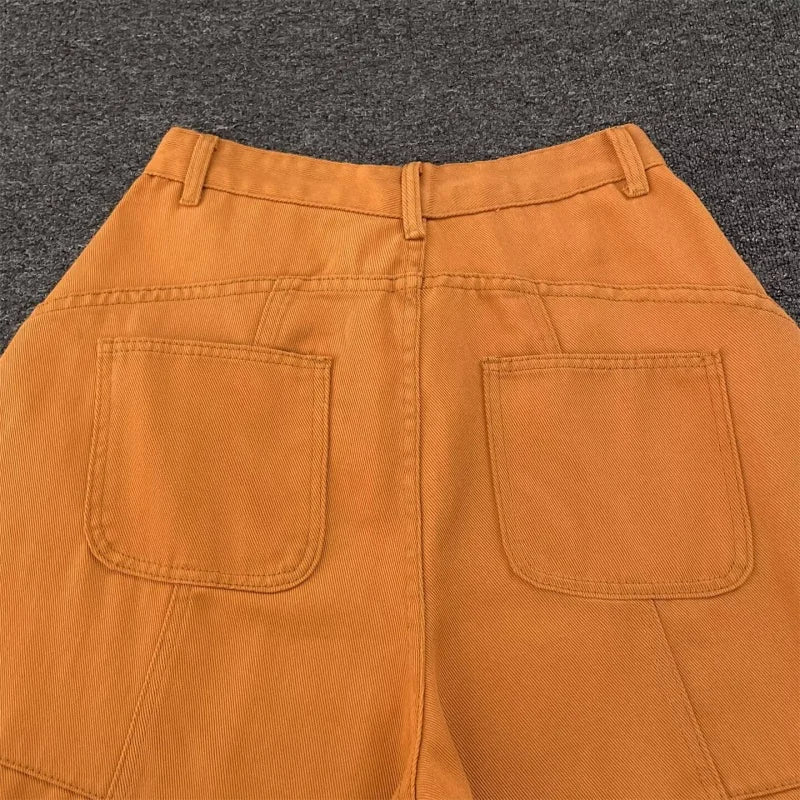 Back patch pockets on orange barrel pants, close up
