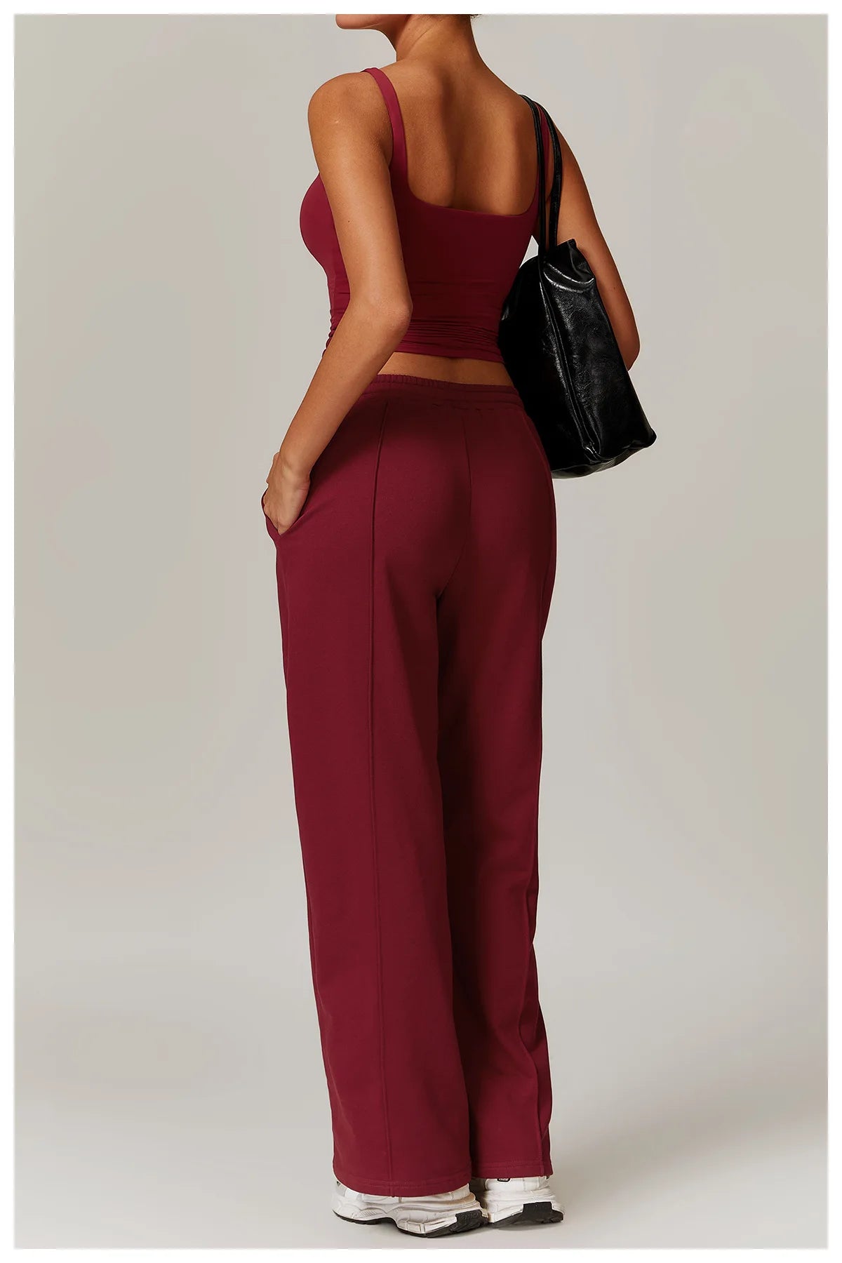Red square neck tank top with trousers, side view