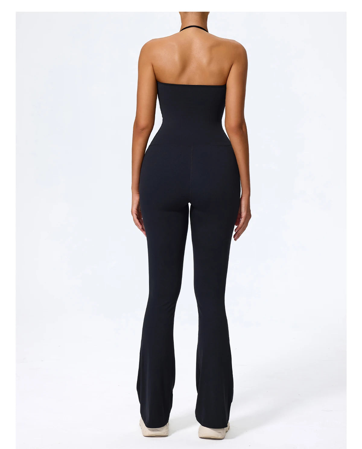 Black halter jumpsuit rear view showing the halter tie and open back