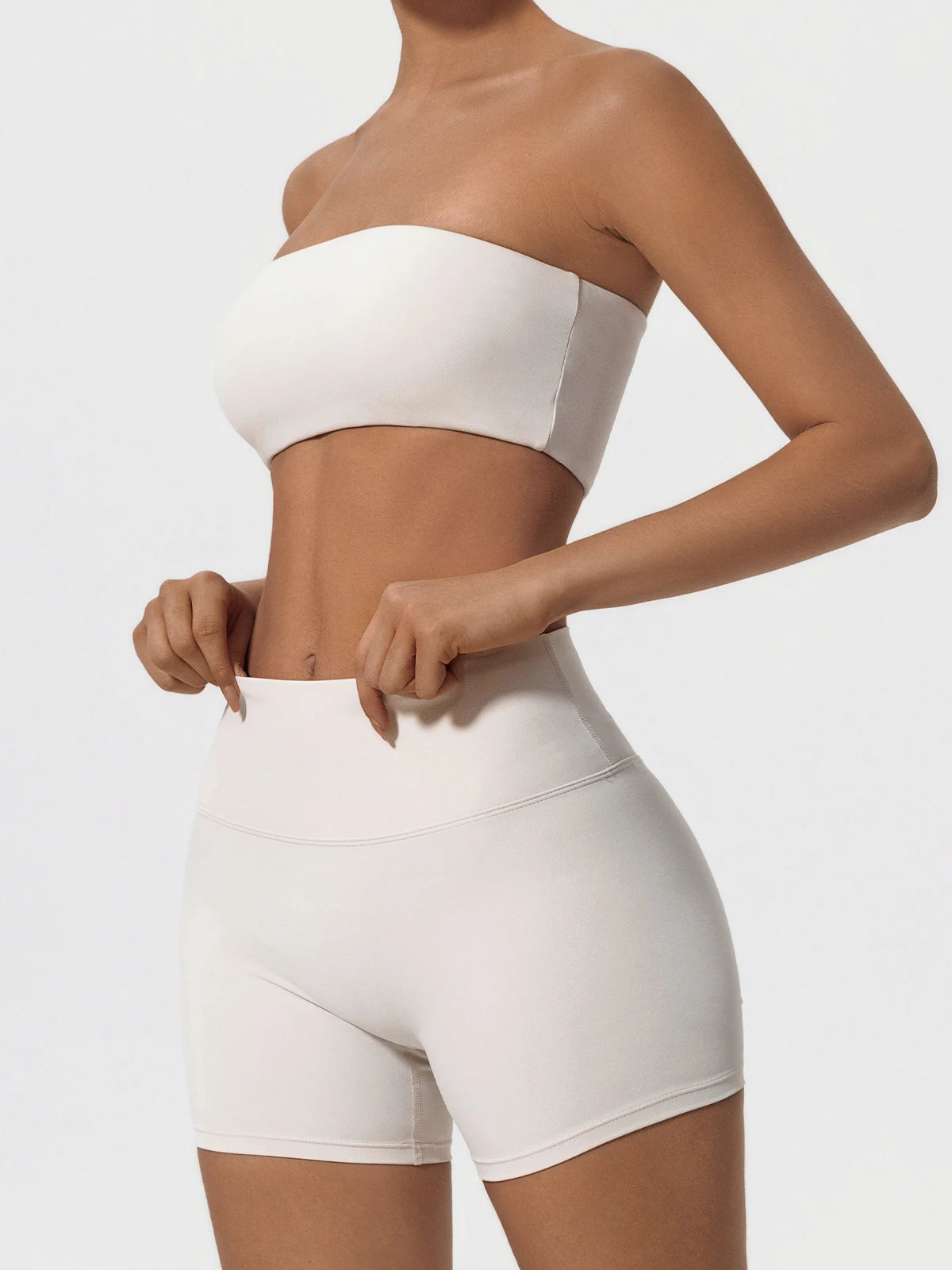 Ivory womens workout set, front view with hands at the waist