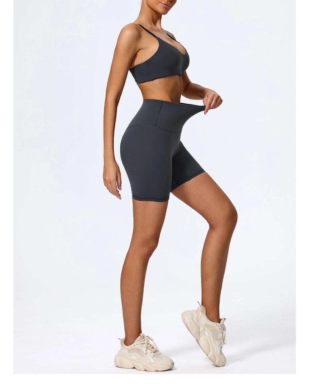 Navy blue biker shorts and sports bra set, side view