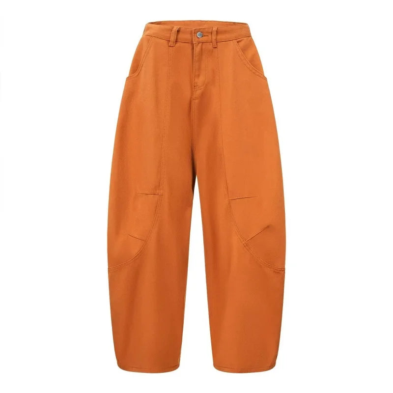 Orange barrel pants flat lay, front, showing thigh seam panels