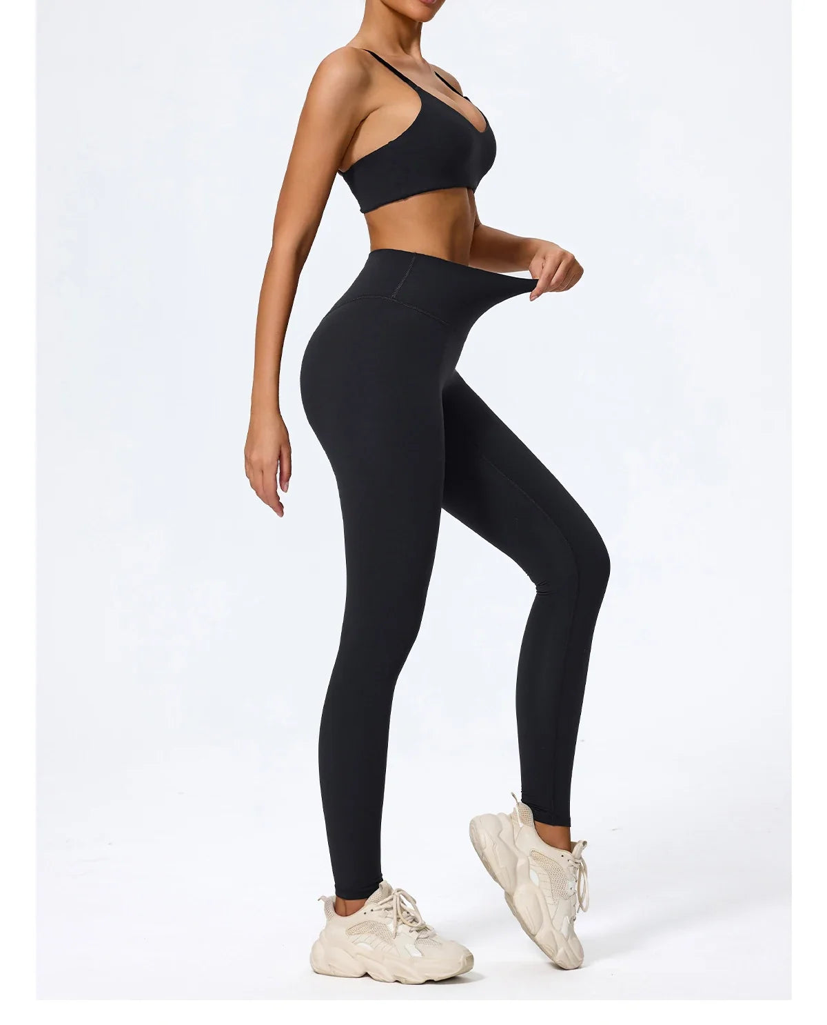 Black high waisted leggings, side view showing the full length