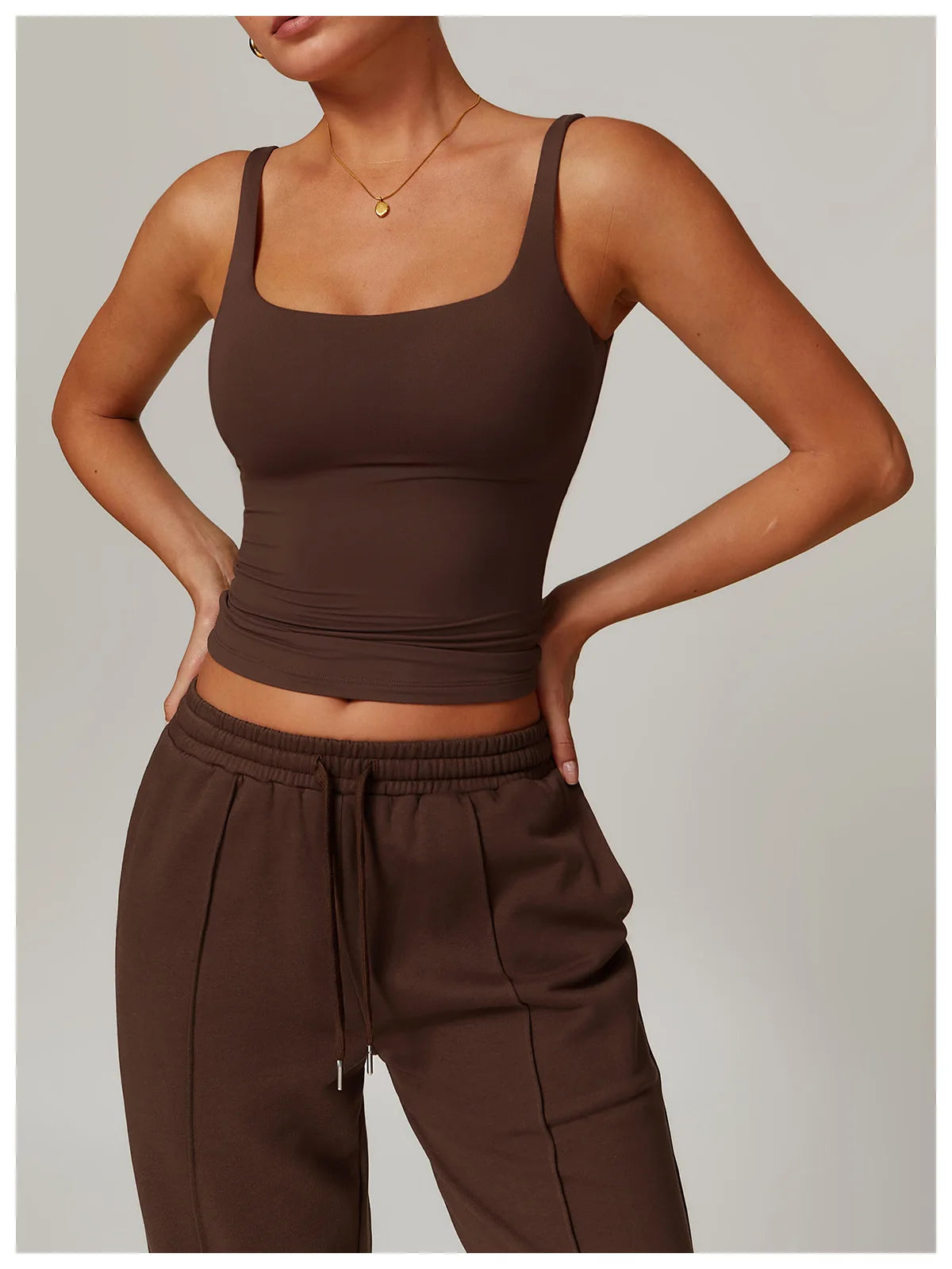 Brown tank top with built in bra, three quarter view on model