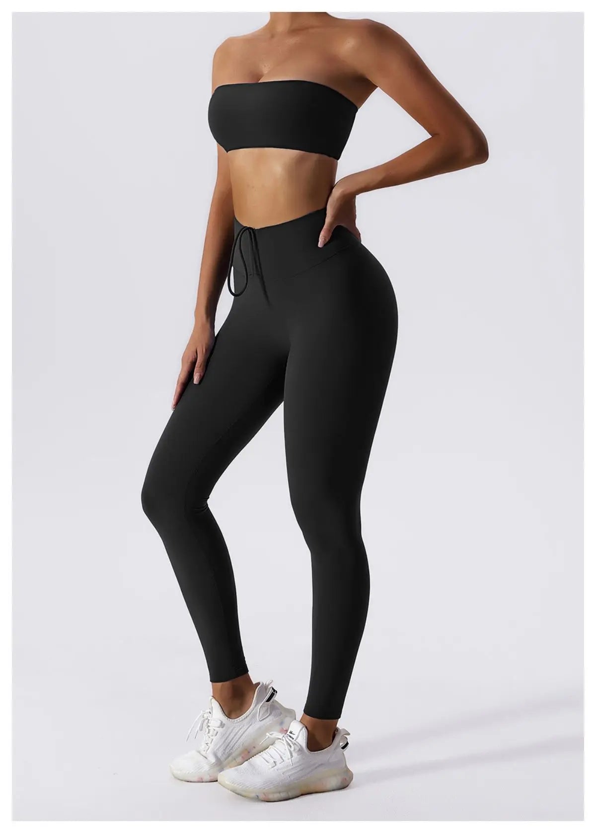 Black bandeau bra and leggings, full length front view
