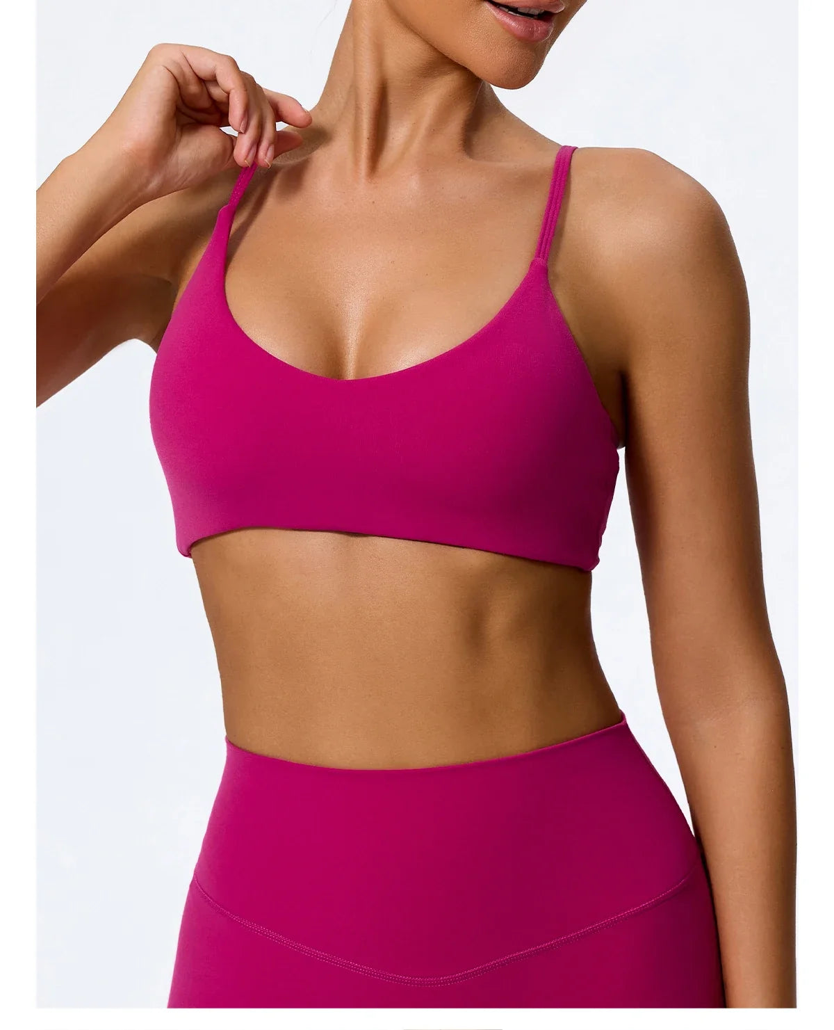 High waisted leggings and sports bra set in rose red, front view on model