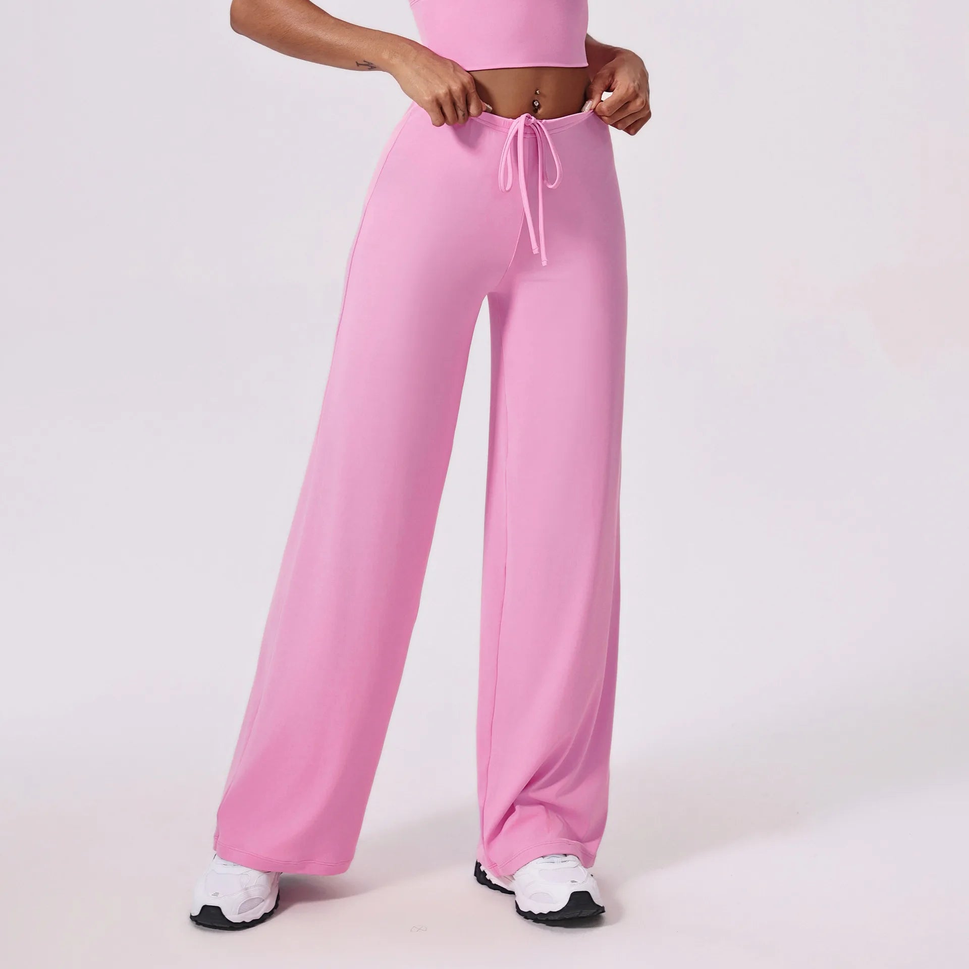 Pink yoga pants, front view with drawstring tied at the waist