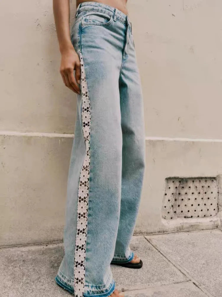 Light wash wide leg jeans for women with lace trim down the leg, front view