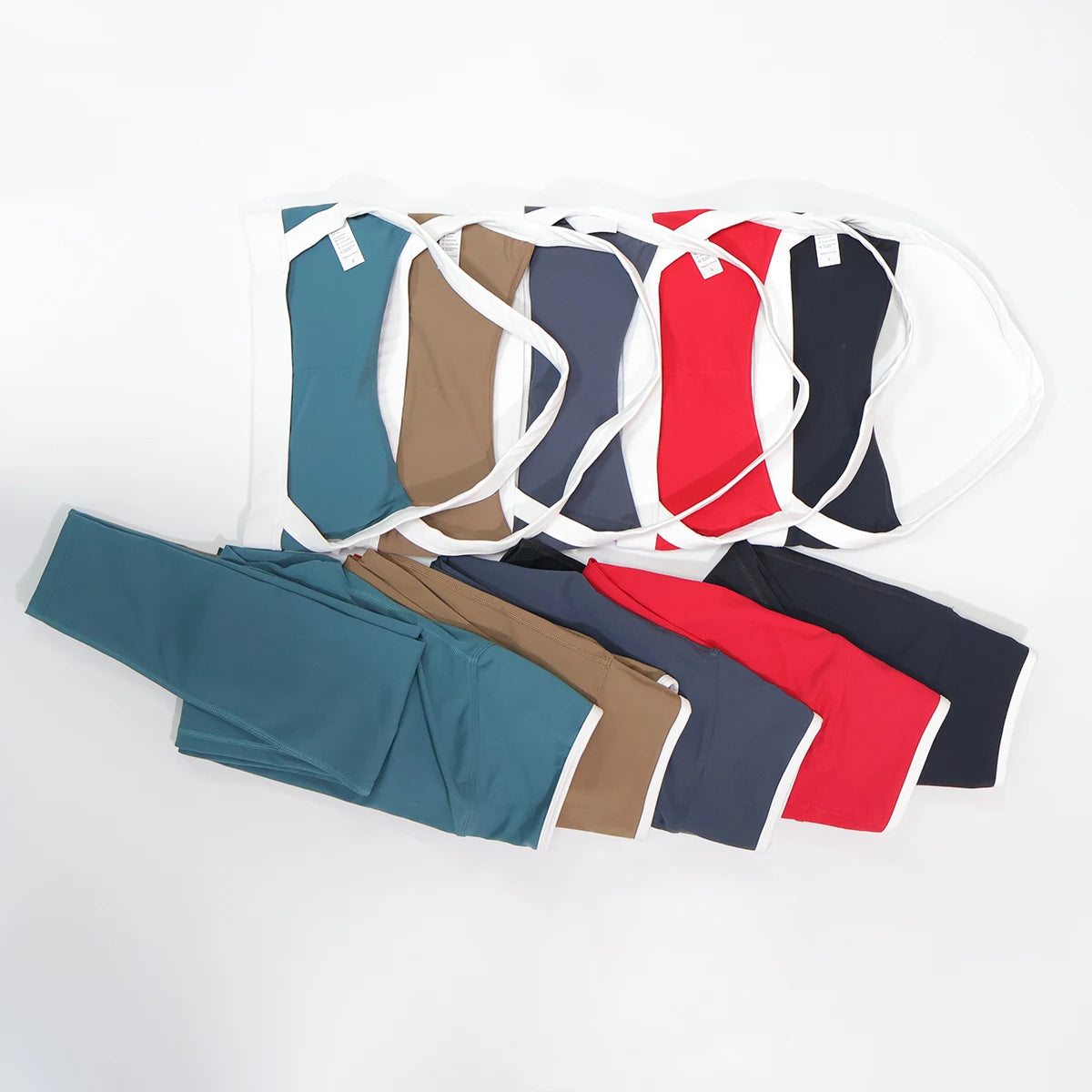 Five colour leggings set range shown together, flat lay