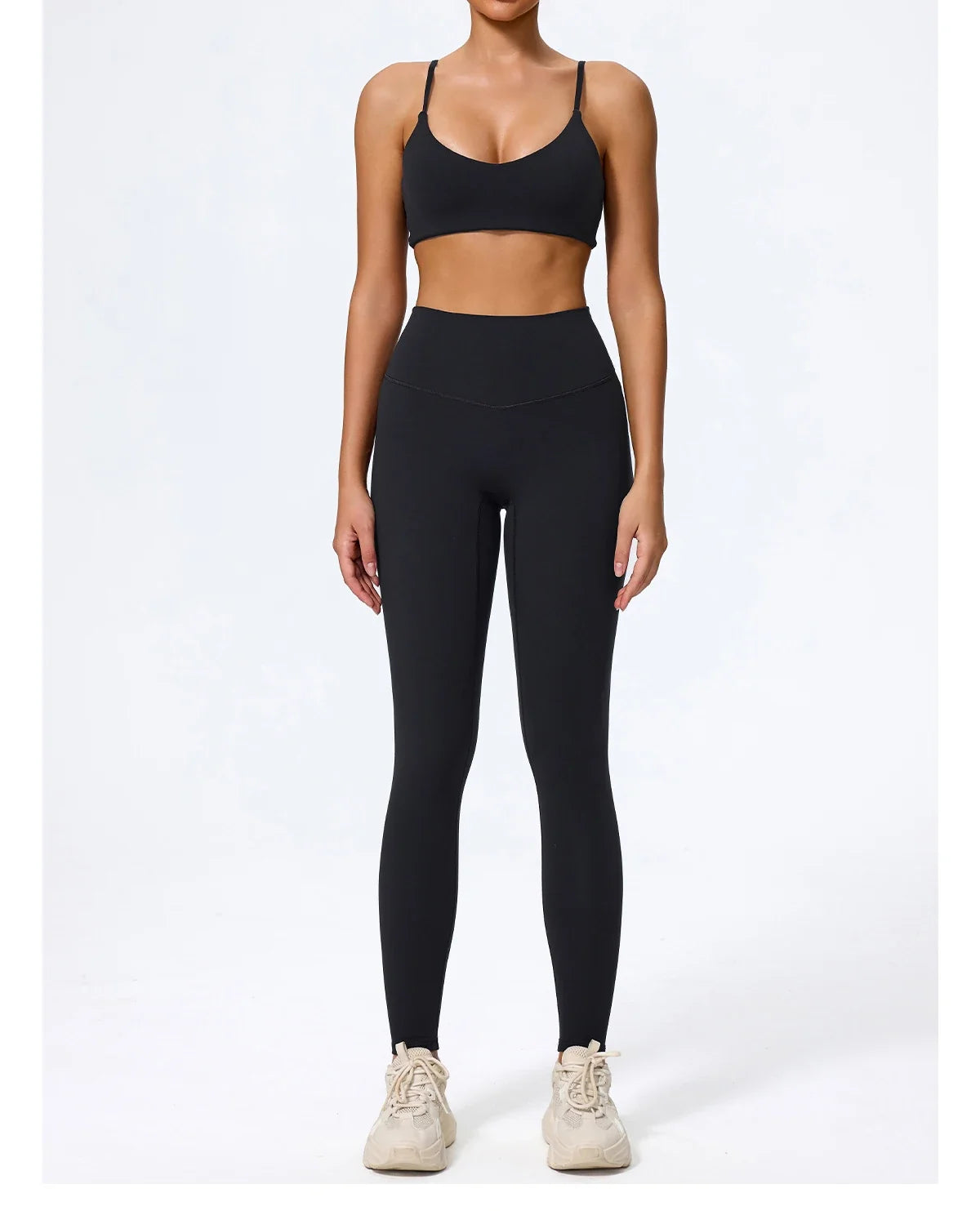 Black leggings and sports bra set, front view on model