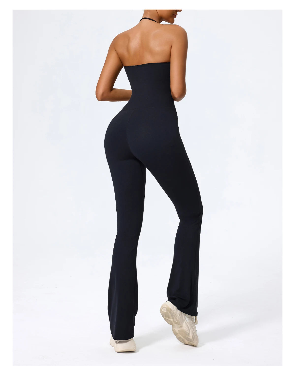 Black jumpsuit back view, open back and fitted seat