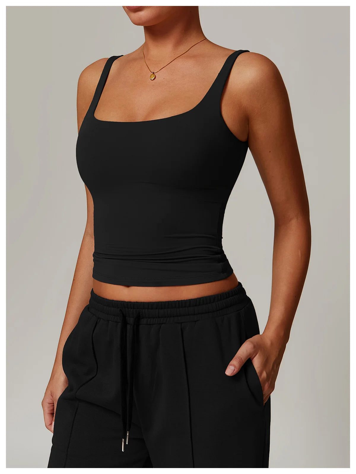 Black tank top back view showing the U shaped back and fixed straps