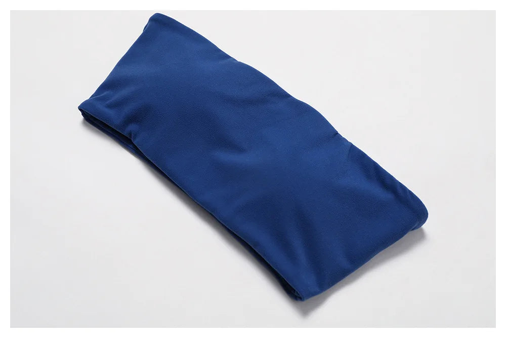 Blue bandeau bra folded flat, showing the single piece construction