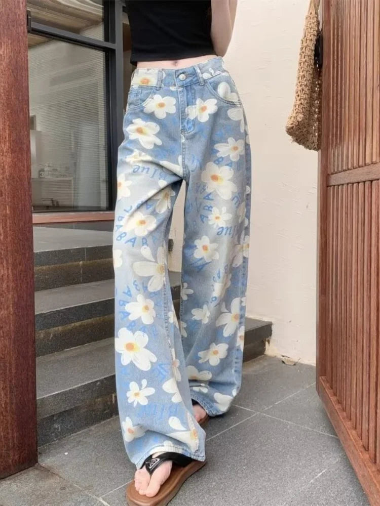 Light wash floral jeans on stairs, full length front