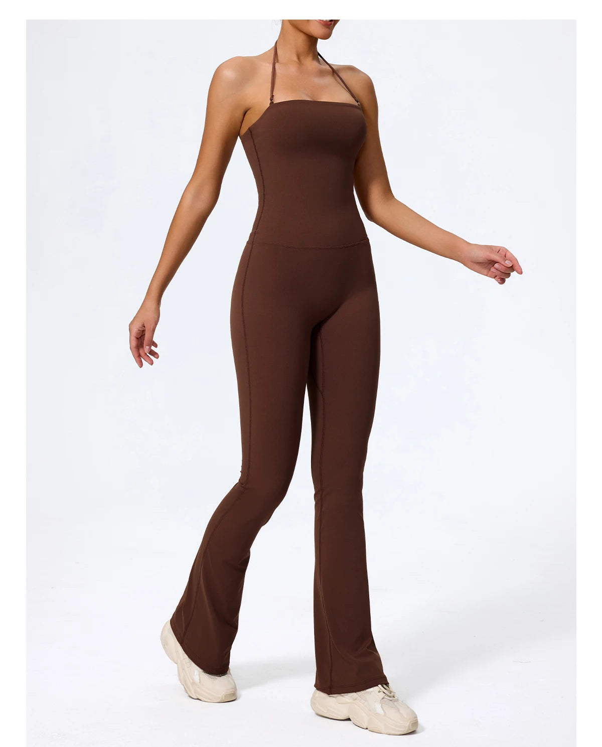 Brown halter jumpsuit front view with hand extended