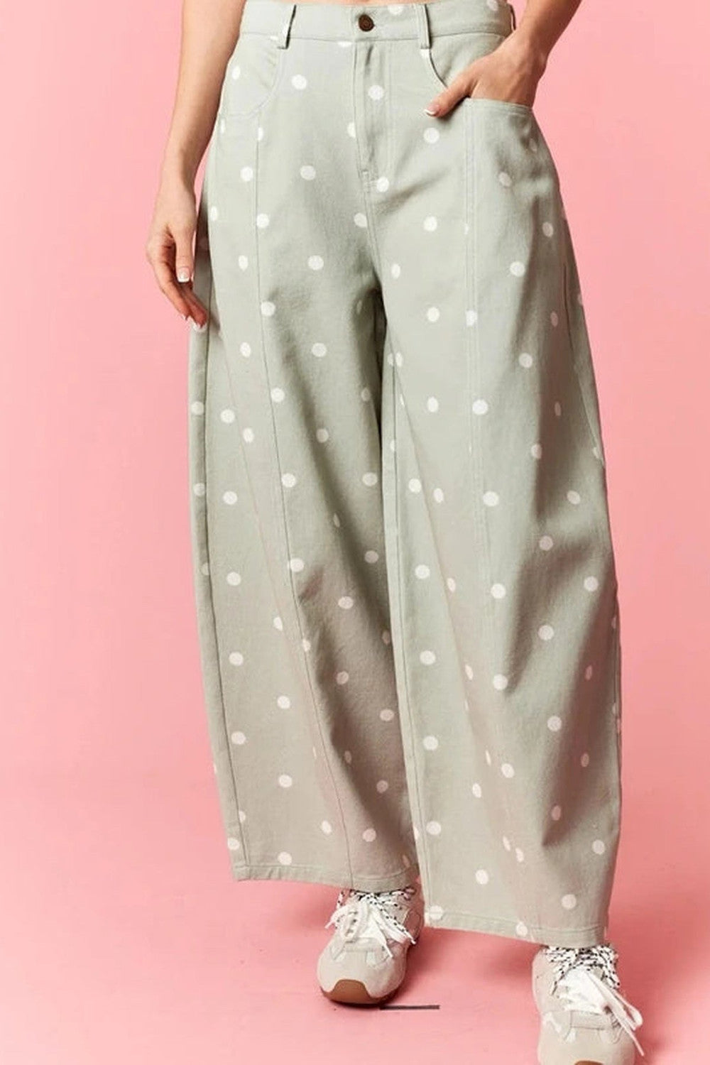 Sage barrel jeans with cream polka dots and a curved wide leg