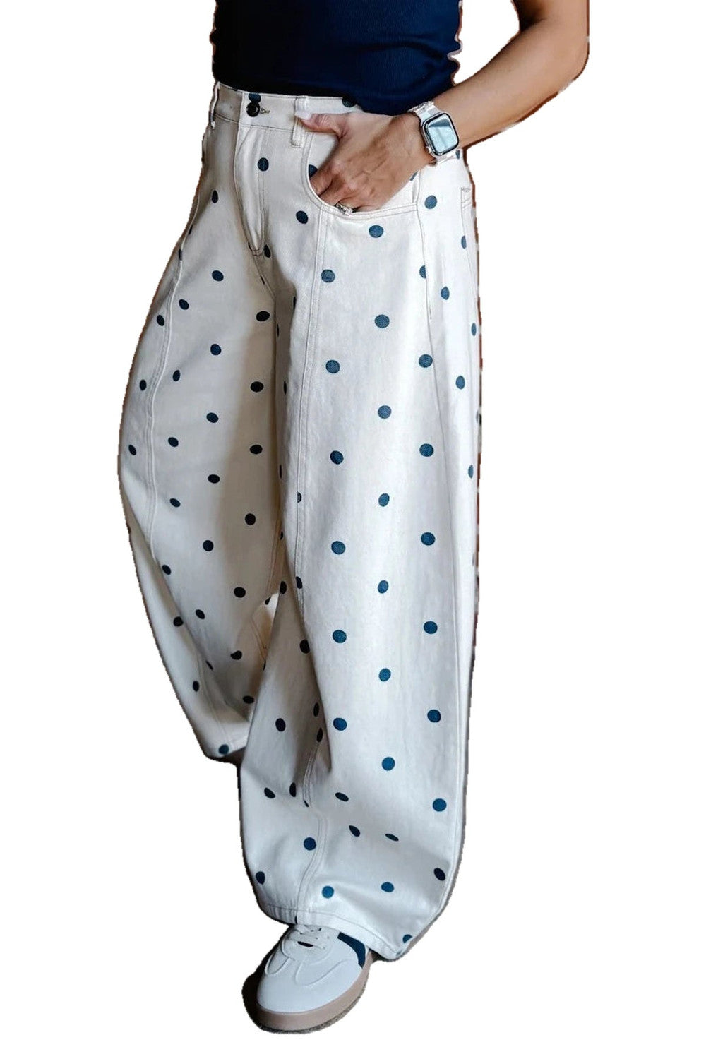 Ivory barrel jeans with navy polka dots worn with white trainers