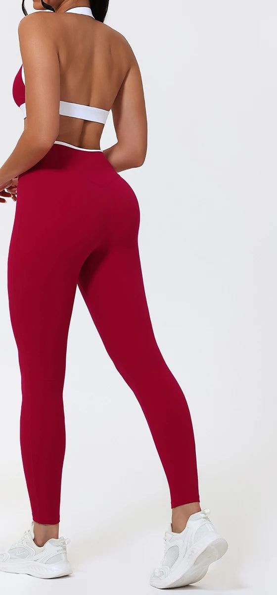 Red butt lift leggings back view showing the curved yoke and centre seam