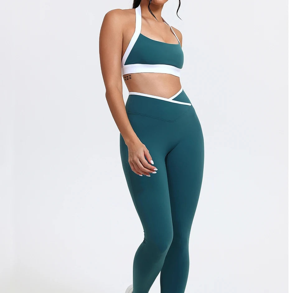 Butt lift leggings and contrast sports bra set in teal green, front view