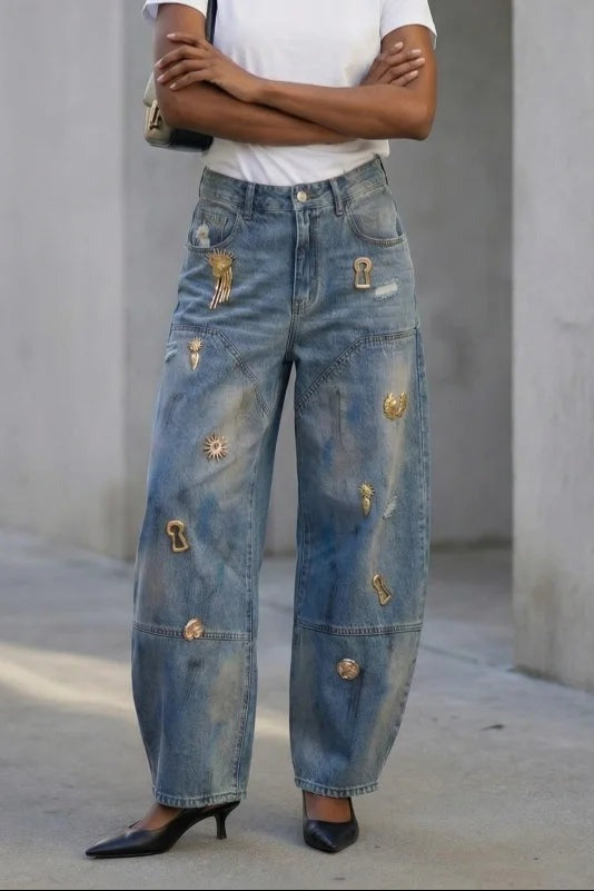 Gold charm embellished barrel jeans on model, front, arms crossed