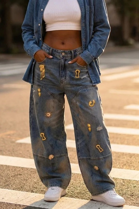 Embellished barrel jeans outdoors with denim jacket and white trainers