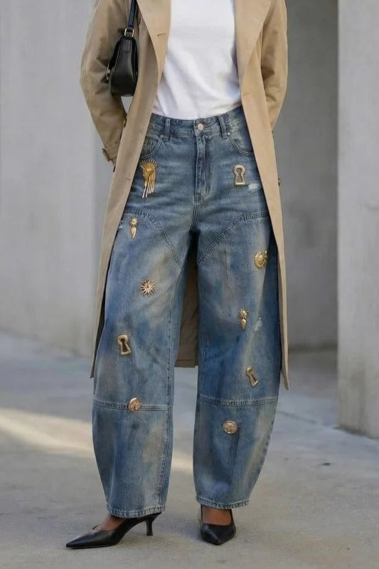Blue barrel leg jeans with metal charms, full length, second angle