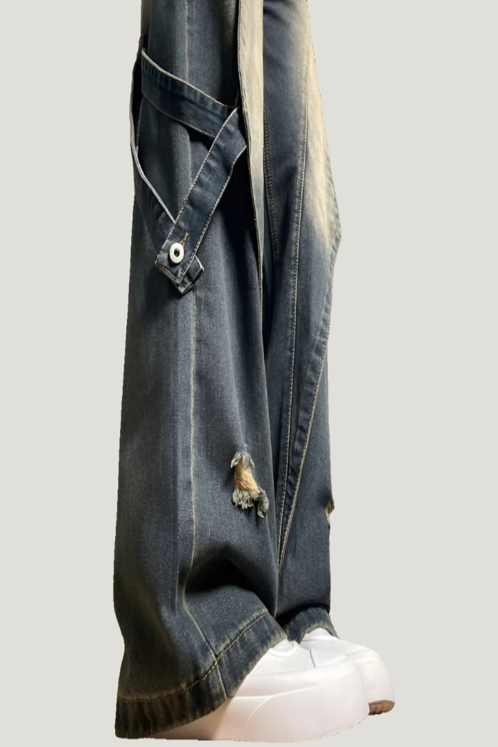 Y2K jeans thigh strap detail with button, wide leg hem over platform trainer